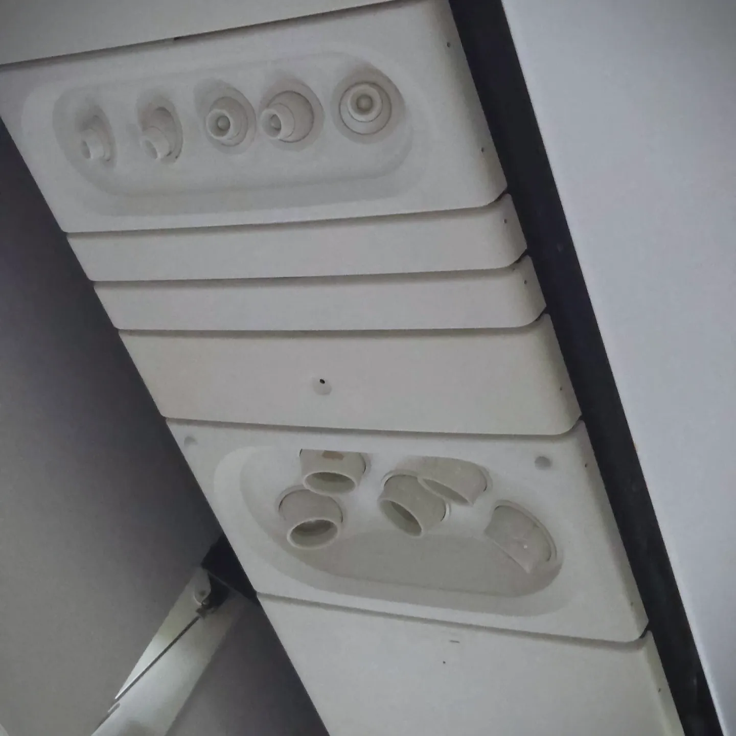 Safety Card, Main Cabin Extra Overhead Bin, and Overhead Reading Lights on American Airlines B777-200ER