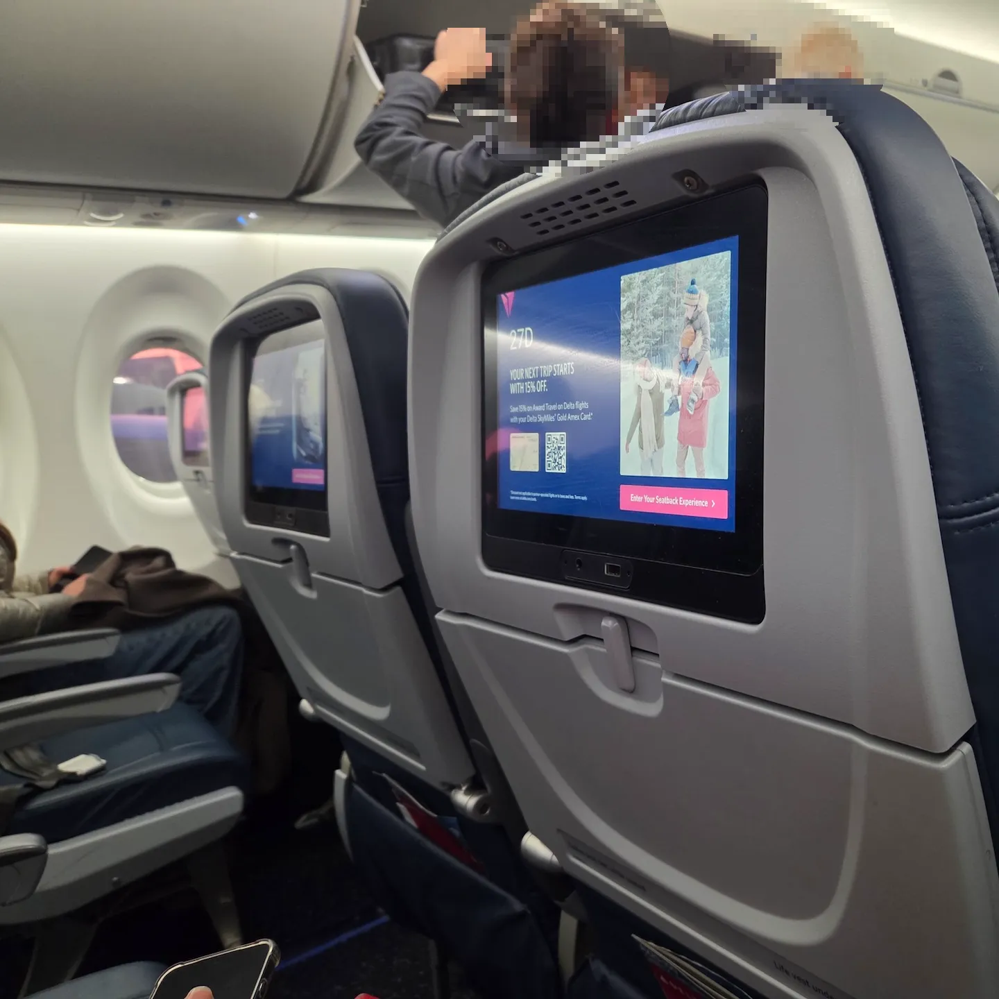 Delta Air Lines A220-100 Main Cabin entertainment screen and power outlet