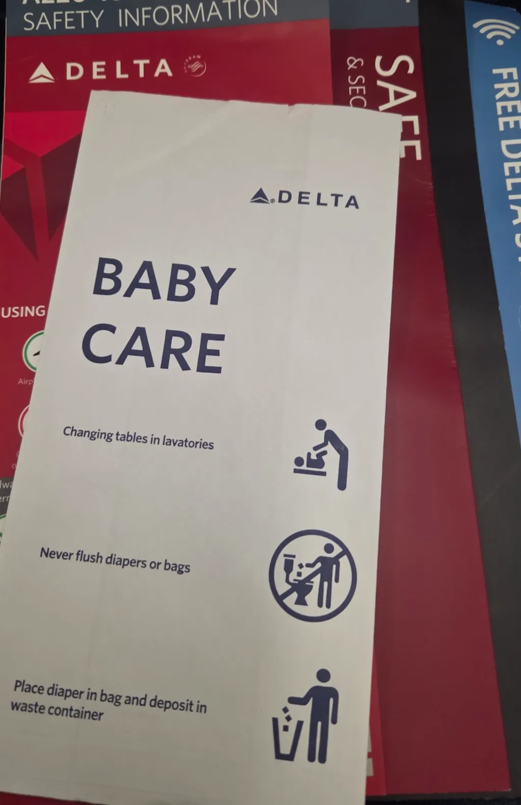 Safety cards and menus stored on Delta Air Lines A220-100