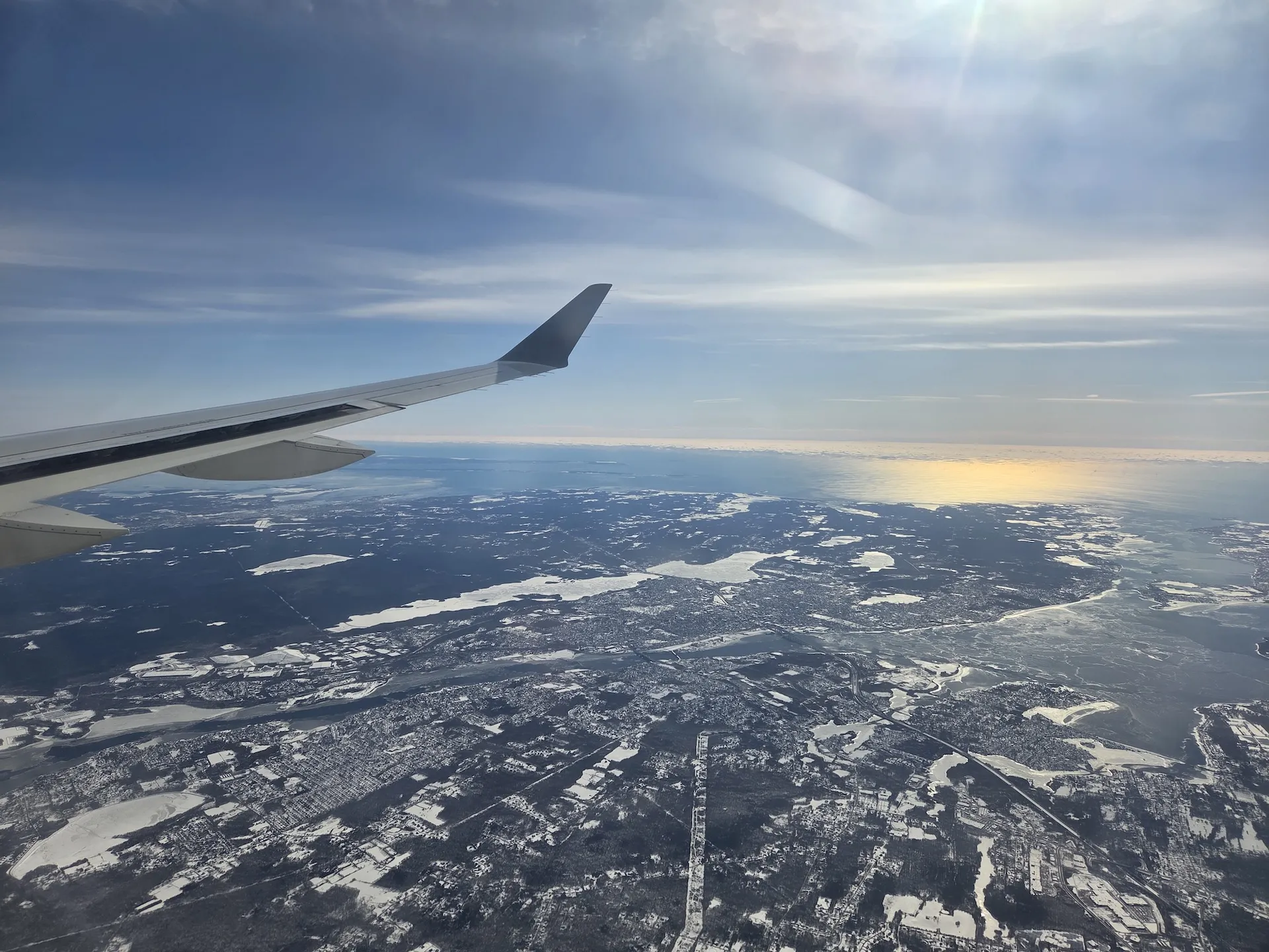 Snow-covered New England landscape and Boston Logan International Airport