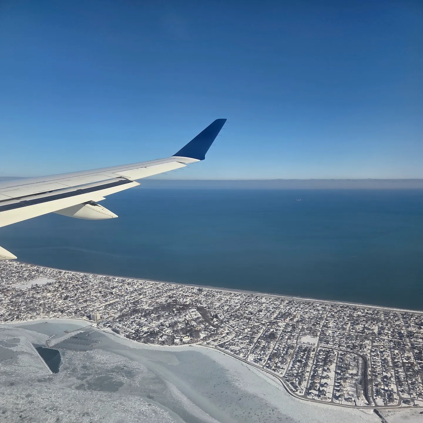 Snow-covered New England landscape and Boston Logan International Airport