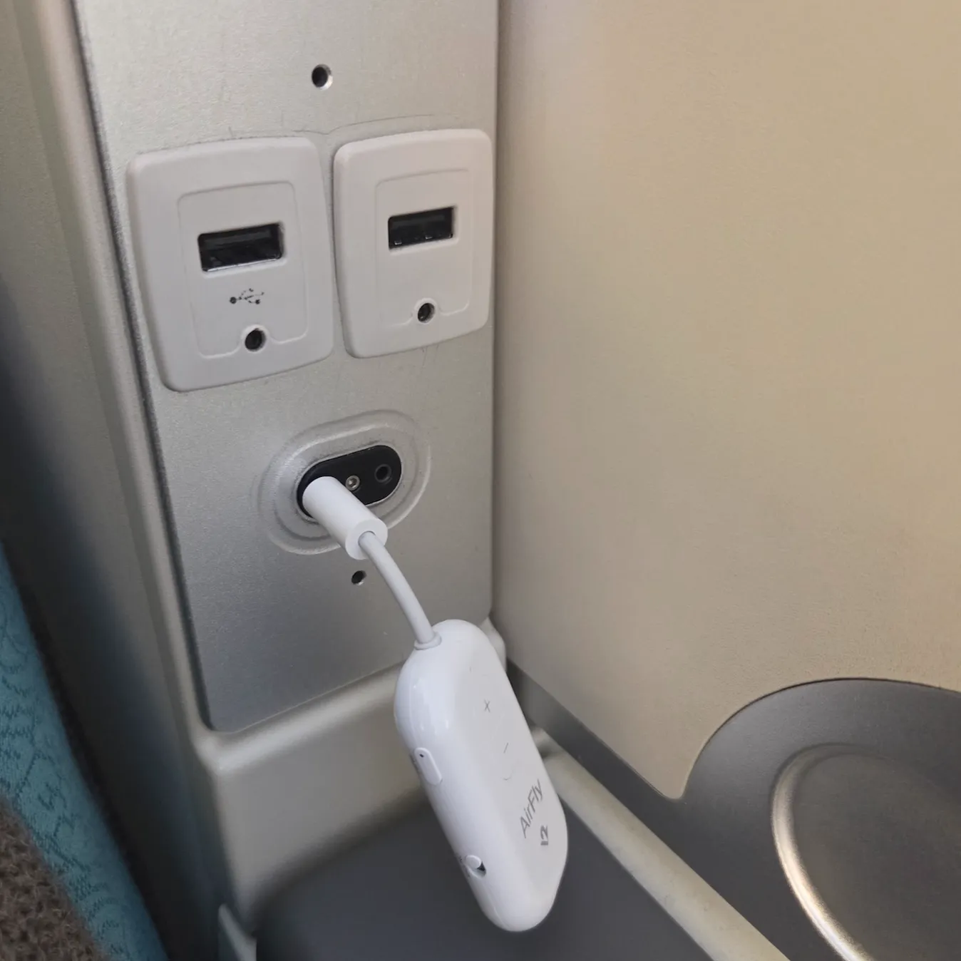 Bluetooth Audio Transmitter Used Often During Flights and the Provided 500ml Bottled Water