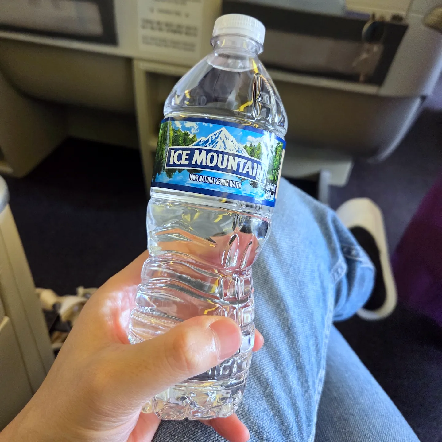 Bluetooth Audio Transmitter Used Often During Flights and the Provided 500ml Bottled Water