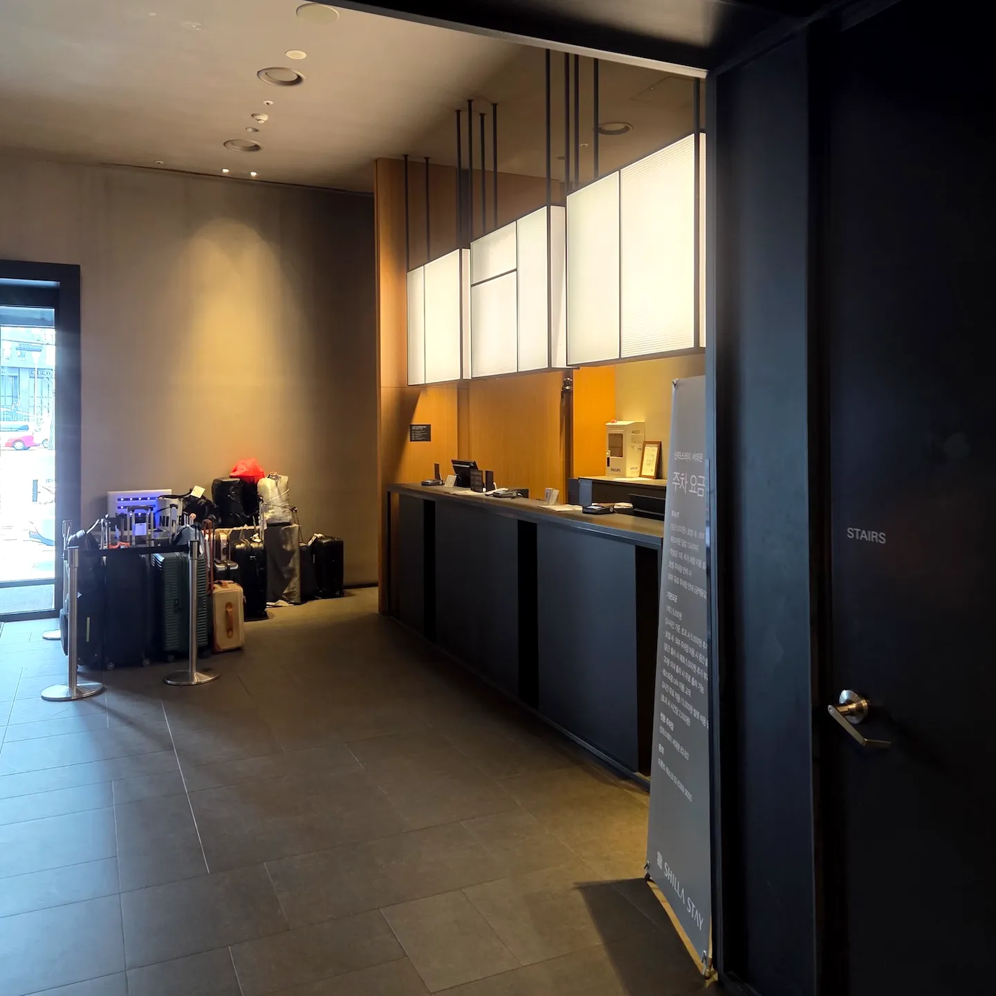 Check-in counter and waiting area at Shilla Stay Seodaemun